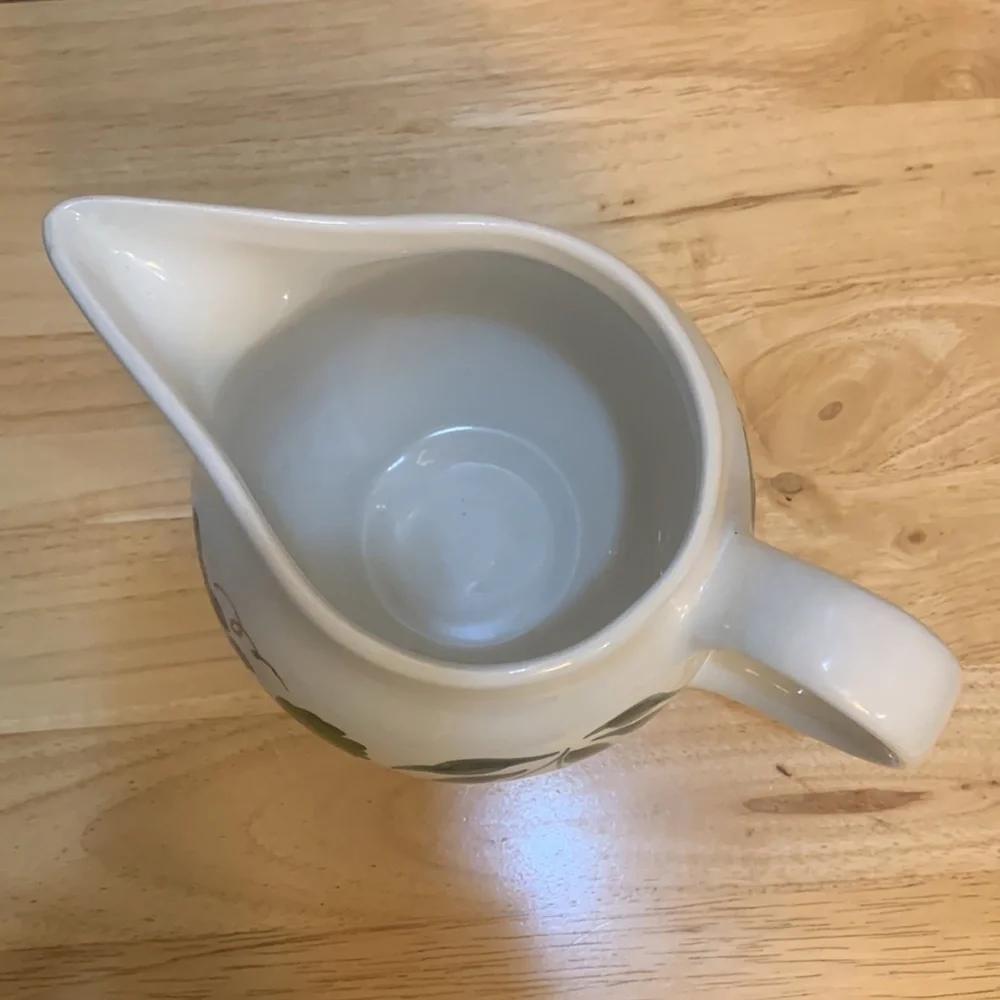 Crate & Barrel white ceramic pitcher hand painted with cherries and grapes.